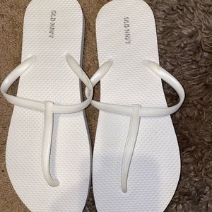 White Old Navy flip flops.